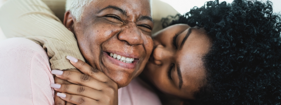 Happy mother and daughter having tender moment together